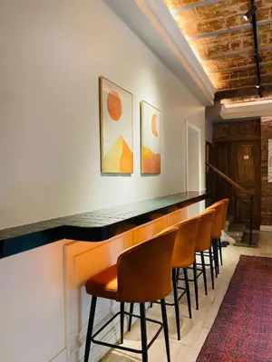a bar in a room with a row of chairs at Pera Standard Rooms in Istanbul
