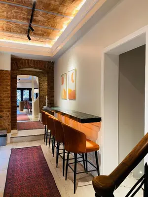 a bar in the middle of a room with chairs at Pera Standard Rooms in Istanbul
