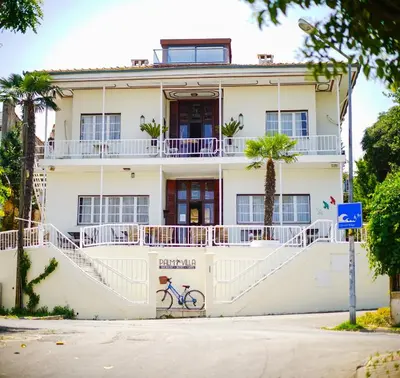 a building with a bike parked in front of it at Palm Villa Büyükada in Istanbul