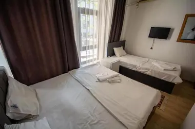a hotel room with two beds and a window at Altun Life City in Istanbul