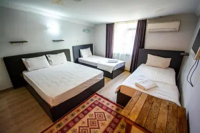 a hotel room with two beds and a window at Altun Life City in Istanbul