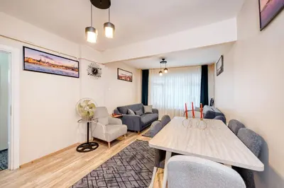 a living room with a couch and a table at MARMARA DREAM APARt in Istanbul