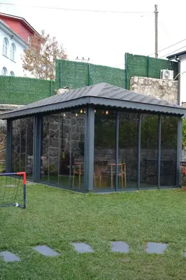 a gazebo with a table and chairs in a yard at Parna Sapanca Hotel in Sakarya