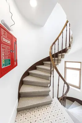 a staircase in a house with a red sign at Big Urban Taksim Terrace Stay in Istanbul