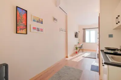 a white kitchen with a sink and a counter at Casa Nozze in Istanbul