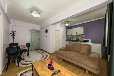 a living room with a couch and a table at Cenova Suite Hotel in Istanbul