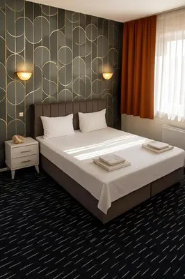 a bedroom with a large bed in a room at Anı Park Hotel in Pendik
