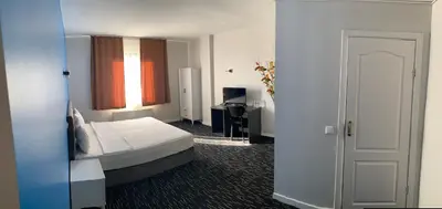 a hotel room with a bed and a window at Anı Park Hotel in Pendik