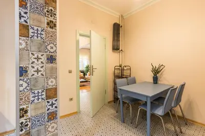 a dining room with a blue table and chairs at Stylish 1BR with Prime Location and Bold Design in Istanbul