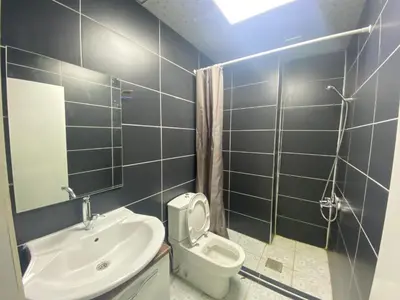 a bathroom with a sink and a toilet and a mirror at Kocaeli Konaklama in Izmit