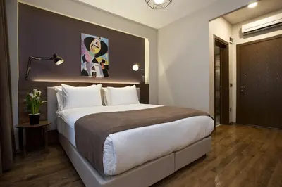a bedroom with a large bed in a room at Snog Rooms & Suites in Istanbul