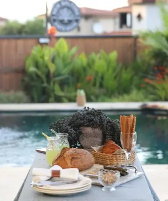 a tray of bread and pastries on a table at New Balturk Nature Villas in Sapanca