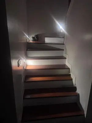 a set of stairs with a light on them at Cadde Sapanca Sıcak Havuzlu Geniş Bahçeli in Sapanca