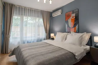 a bedroom with a large bed and a window at Cozy and Modern 3BR with Private Patio in Beşiktaş in Istanbul
