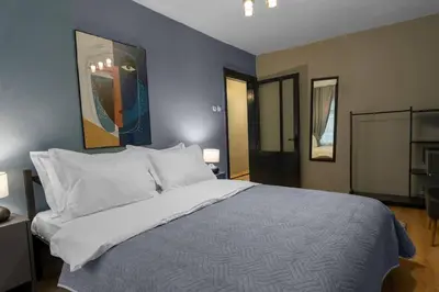 a bedroom with a large bed with white pillows at Cozy and Modern 3BR with Private Patio in Beşiktaş in Istanbul