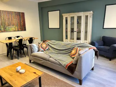 a living room with a couch and a table at Elegant and Cozy 2BR with Balcony near Taksim in Istanbul