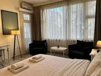 a bedroom with a large bed with two towels on it at Elegant and Cozy 2BR with Balcony near Taksim in Istanbul