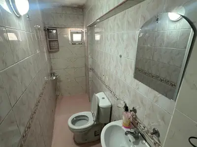 a small bathroom with a toilet and a sink at Kaman Home Apart in Istanbul