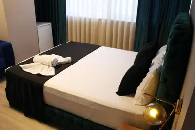 a bedroom with a bed with a towel on it at Lina Suit Hotel in Istanbul