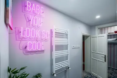 a pink sign that reads bake you look so cool on a wall at Cozy Private Home in Kadıköy – Near Coast Ferry in Istanbul