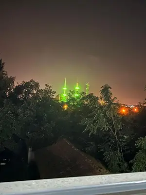 a city skyline at night with green lights at Lux Villa Silivri Kavakli in Silivri