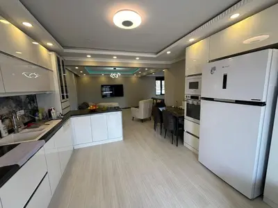 a kitchen with white cabinets and a white refrigerator at Lux Villa Silivri Kavakli in Silivri