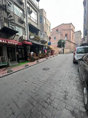 an empty city street with cars parked on the street at Massa Home TAKSİM in Istanbul