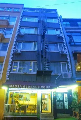 a building with a guitar on the side of it at Massa Home TAKSİM in Istanbul