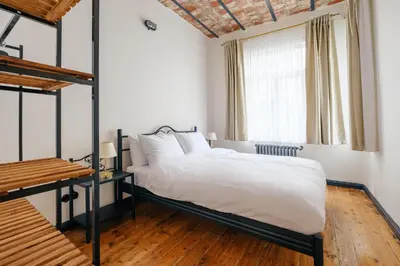 a bedroom with a bed and a window at Cozy Flat with Balcony Near Istiklal Avenue in Istanbul