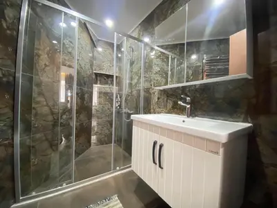 a bathroom with a sink and a shower at Central Comfortable Flat in Historic Balat in Istanbul