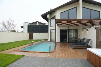 a house with a swimming pool in the backyard at Cevizdibi Loft Villa in Kartepe