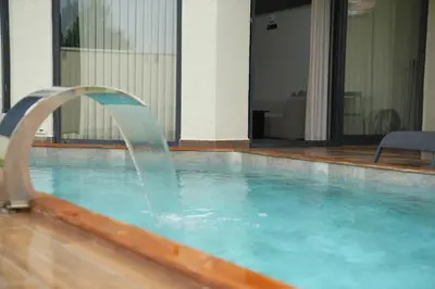a water fountain in a swimming pool at Cevizdibi Loft Villa in Kartepe