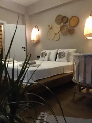 a bedroom with a bed with logs on the wall at Fcvillasapanca in Sapanca