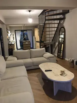 a living room with a couch and a coffee table at Fcvillasapanca in Sapanca