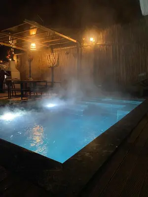 a pool with steam coming out of it at night at Fcvillasapanca in Sapanca