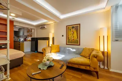 a living room with a couch and a table at Cosy Apartment in Beyoglu in Istanbul