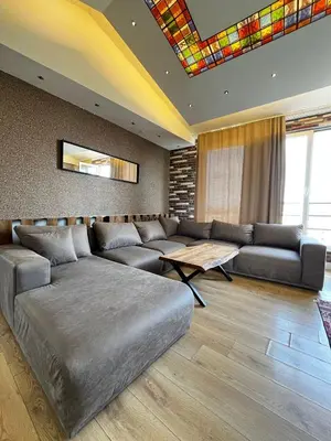 a living room with a couch and a table at SE Group Corner Suites in Istanbul