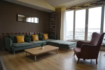 a living room with a couch and a table at SE Group Corner Suites in Istanbul