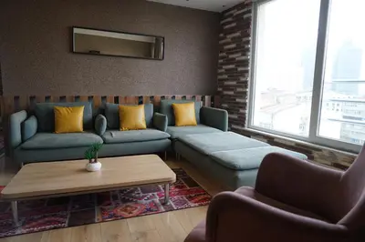 a living room with a couch and a table at SE Group Corner Suites in Istanbul