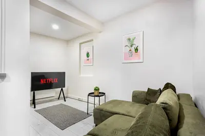a living room with a couch and a tv at Akçe 6 in Istanbul