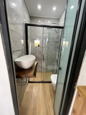 a bathroom with a sink and a glass shower at Deluxe Valeria in Istanbul