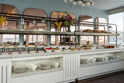a buffet line with dishes and food on display at Adamar Hotel-Special Category in Istanbul