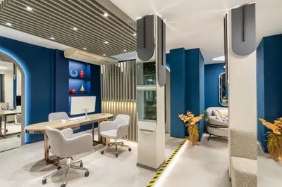 an office with blue walls and a desk and chairs at Adamar Hotel-Special Category in Istanbul