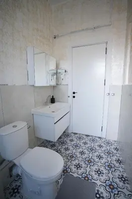 a bathroom with a toilet and a sink and a door at i1 Historic House Hotel with Gorgeous View in Istanbul