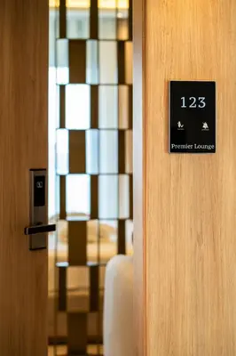 a door with a sign that reads premier living room at Premier Lounge Hotel in Tuzla
