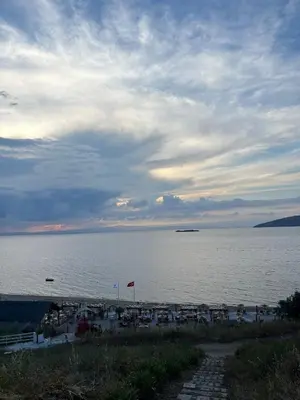 a beach with a large body of water at Ege Naz Villa in Avsa Adasi