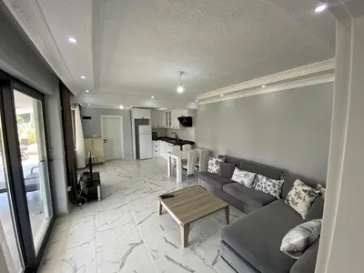 a living room with a couch and a table at Ege Naz 1 in Marmara