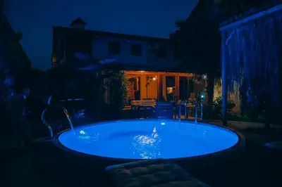 a hot tub in a yard at night at Sapanca Villa Şen in Sapanca