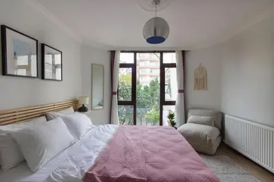 a bedroom with a large bed and a window at 3BR Villa with Garden & Terrace in Kadikoy in Istanbul