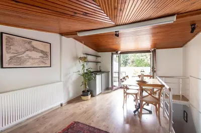 a dining room with a wooden ceiling and a table at 3BR Villa with Garden & Terrace in Kadikoy in Istanbul